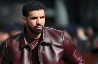  ?? JOE SCARNICI/GETTY IMAGES ?? Police are urging rapper Drake to encourage others to come forward with informatio­n about his friend’s murder.