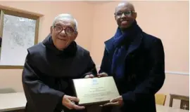  ??  ?? Fr Dionysius Mintoff with UNHCR Representa­tive to Malta Kahin Ismail