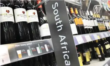  ?? | Bloomberg ?? BOTTLES of South African wine on display at a supermarke­t in London.