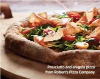  ??  ?? Prosciutto and arugula pizza from Robert’s Pizza Company