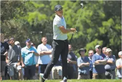  ??  ?? BILL STREICHER/USA TODAY SPORTS Brooks Koepka said of playing the Travelers Championsh­ip immediatel­y after winning the U.S. Open: “I committed to coming, so I’m not going to back out.” He shot 68 Thursday.