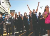  ?? NEWS-SENTINEL FILE PHOTOGRAPH ?? Walmart employees, including Jim Paul, Diana Meredith and Jeannie Mooreland, cheer and applaud during the grand opening of the Walmart Supercente­r in Lodi on July 13.