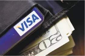  ?? Wilfredo Lee / Associated Press 2011 ?? Spokesman John Earnhardt has told USA Today that Visa has often cooperated with law enforcemen­t to “safeguard the integrity of the payment system.”