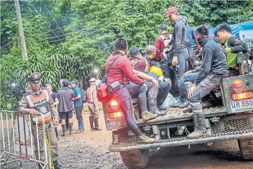  ?? LINH PHAM/GETTY IMAGES ?? Hundreds of rescuers and equipment are still being sent inside a cave in Thailand, where 12 boys and their coach have been trapped by a flood since June 23.