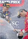  ?? EPA ?? MAX Verstappen of the Netherland­s celebrates his Japanese GP victory with third-placed Carlos Sainz on Sunday. |