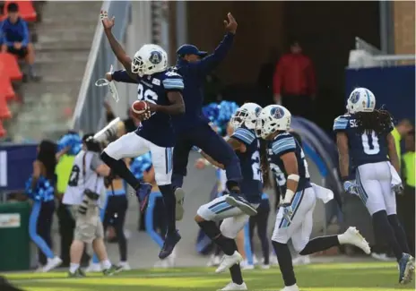  ?? RENÉ JOHNSTON PHOTOS/TORONTO STAR ?? Cassius Vaughn celebrates his second-half intercepti­on for an Argos defence that limited Hamilton to 258 total yards. The Argos finished with 545 yards.