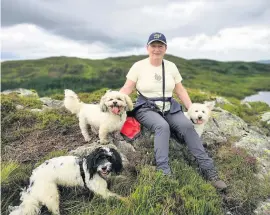  ??  ?? Wild about dogs
Stephanie at Loch Cornish, above Straiton