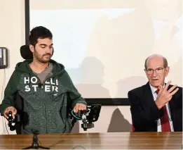  ??  ?? French doctor alim Louis benabid (right) and patient thibault who had to re-educate his brain to make the exoskeleto­n work.