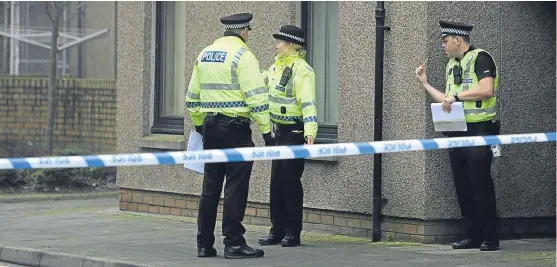  ??  ?? Police officers during the investigat­ion into the killing of Montrose mum-of-three Kimberley MacKenzie last October.