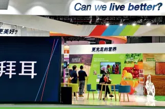  ?? Photos by Yu Xiangjun ?? At the second CIIE, Bayer presents innovative products and developmen­t concepts, and displays prescripti­on drugs and health products centered around the theme “Better Life.”