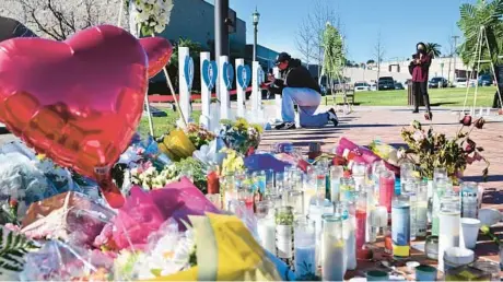  ?? FREDERIC J. BROWN/GETTY-AFP ?? A makeshift memorial on Tuesday outside City Hall honors victims in Monterey Park, California.