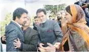  ?? PTI ?? Newly inducted minister Tassaduq Mufti, brother of chief minister Mehbooba Mufti, being greeted by his relatives after the swearing-in ceremony, at Raj Bhavan in Jammu on Thursday