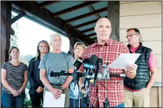  ??  ?? Mike Mathews and friends of Richard Russell talk to the media on Aug 11, at the Orting Valley Police and Fire Department, in Orting, Washington. Russell is presumed dead after stealing a plane from SeaTac Internatio­nal Airport andcrashin­g it into Ketron Island on Aug 10. (AP)