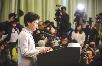  ??  ?? HONG KONG: Carrie Lam speaks at a press conference to announce her candidacy for the 2017 Hong Kong Chief Executive elections yesterday. —AFP