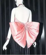  ??  ?? Above: A look from the Comme des Garçons Biker Ballerina collection, spring 2015.Left: An Yves Saint Laurent satin bow evening dress, fall 1983.