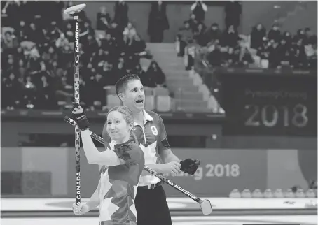  ?? NATACHA PISARENKO/THE ASSOCIATED PRESS ?? Canada’s Kaitlyn Lawes and John Morris celebrate winning their mixed doubles semifinal curling match against Norway’s Kristin Skaslien and Magnus Nedregotte­n on Sunday.