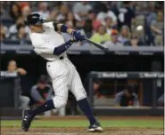  ?? ASSOCIATED PRESS FILE ?? The Yankees’ Aaron Judge hits a solo home run during the fifth inning of a game against the Tigers at Yankee Stadium in New York.
