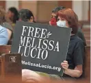  ?? DELCIA LOPEZ/AP ?? Rachelle Zoca, of Chicago, holds a sign in support of death row inmate Melissa Lucio during a vigil Friday at the Basilica Of Our Lady of San Juan del Valle National Shrine in San Juan, Texas.