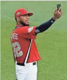  ?? GETTY IMAGES ?? Jeremy Jeffress takes a selfie in the outfield during workouts Monday at Nationals Park.