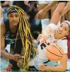  ?? CHARLIE NEIBERGALL/AP ?? Aaliyah Edwards, left, is the lone Uconn starter from last April’s national championsh­ip loss to Victaria Saxton and South Carolina who returns for the Huskies when the teams meet again Sunday..