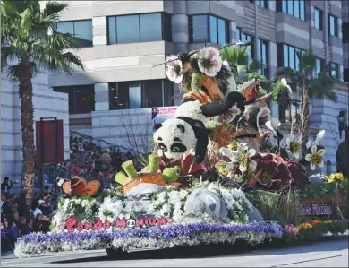 ?? ZHANG SHUO / CHINA NEWS SERVICE ?? A panda-themed float makes its way along the parade route at the 129th Rose Parade in Pasadena, California, on Monday. The theme of the 2018 parade was “Making a Difference”.