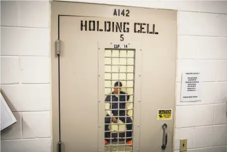  ?? David Goldman / Associated Press 2019 ?? A detainee sits in a cell in Lumpkin, Ga. The town’s 1,172 residents are outnumbere­d by the 1,650 male detainees held there.