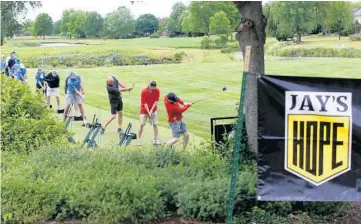  ?? ANTONIO PEREZ/CHICAGO TRIBUNE PHOTOS ?? Golfers and friends of Jay Burger hit their drives at the Jay’s Hope Golf Tournament fundraiser, held in his honor at Eagle Brook Country Club in Geneva on June 21.