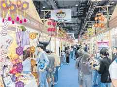  ?? ?? People browse domestic travel deals at the ‘Amazing Thailand Travel Fair 2022’ held during Dec 15-18 at Queen Sirikit National Convention Center.