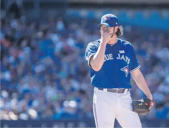  ?? THE CANADIAN PRESS ?? Blue Jays relief pitcher Jason Grilli was touched up for four solo homers in the eighth inning of Toronto’s 7-0 home loss to the Yankees in Toronto on Saturday at Rogers Centre. Grilli has now given up a whopping nine home runs in 17.2 innings of work.