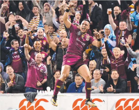 ?? Picture: GETTY ?? Valentine Holmes celebrates scoring one of his three tries in the Maroons’ 22-6 win in Game Three of last year’s Origin series at Suncorp Stadium.