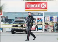  ?? GRAHAM PAINE METROLAND ?? Two Halton police officers were rushed to hospital after a shooting incident at a Esso gas bar at Harvester Road and Appleby Line.