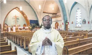  ?? GRAHAM HUGHES THE CANADIAN PRESS ?? Father Gauthier Elleme, inside Ste-Paule’s church in Saint-Jerome, Que., said the threat of closure was a wake-up call for parishione­rs, motivating them to find new sources of revenue.