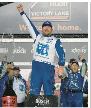  ?? PHELAN M. EBENHACK/AP ?? Chris Buescher celebrates after winning Saturday’s NASCAR Cup regular-season finale at Daytona.