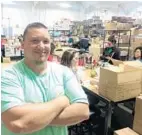 ??  ?? Billy Morrison, director of supply chain and logistics for Rifle Paper Co., oversees operations at the new warehouse in Maitland.