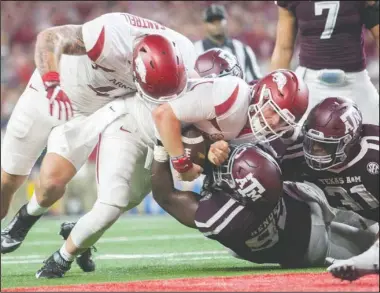  ?? NWA Democrat-Gazette/Jason Ivester ?? TURNED BACK: Texas A&M stops Arkansas quarterbac­k Austin Allen at the goal line in the third quarter of last year’s Southwest Classic. The Razorbacks try to break a five-game losing streak against the Aggies in today’s 11 a.m. game in Arlington, Texas....