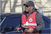  ??  ?? A Salvation Army chaplain arrives after reports of an apparent shooting involving a young girl.