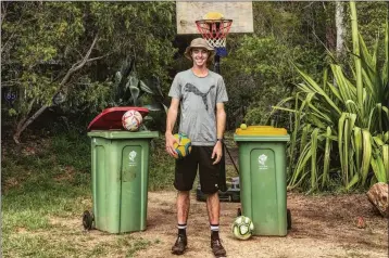  ?? ASSOCIATED PRESS ?? IN THIS PHOTO PROVIDED BY JED HOCKIN, Hockin poses in front of recycling cans and a basketball hoop in Toowoomba, Queensland, Australia.