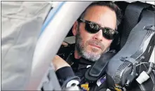  ?? ASSOCIATED PRESS] ?? Jimmie Johnson sits in his car before the NASCAR Daytona 500 race on Sunday. [JOHN RAOUX/ THE