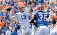  ?? DAVID ROSENBLUM/ICON SPORTSWIRE/AP ?? Florida Gators quarterbac­k Feleipe Franks (13) throws a pass during the Orange & Blue Debut Saturday in Gainesvill­e.