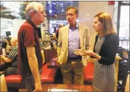  ?? Kaitlyn Krasselt / Hearst Connecticu­t Media ?? Ned Lamont, center, the endorsed Democratic candidate for governor, and former secretary of the state Susan Bysiewicz, speak with Norwalk resident Patrick Vingo, vice president of the advocacy group Parents and Friends of Lower Fairfield Respite Center...