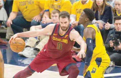  ??  ?? Cleveland Cavaliers centre Kevin Love (0) dribbles the ball defended by Indiana Pacers guard Victor Oladipo (4) in the first half of game six of the first round of the 2018 NBA Playoffs at Bankers Life Fieldhouse. — USA Today Sports