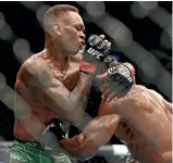  ?? GETTY IMAGES ?? Australian Robert Whittaker, left, is chasing a third crack at the UFC middleweig­ht title of New Zealander Israel Adesanya, who admitted to an off-night in his recent decision win over Jared Cannonier.