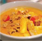  ??  ?? Thai-style Gaeng Phet, a red curry of duck, pineapple and cherry tomatoes.