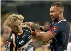  ?? GETTY IMAGES ?? Quade Cooper, right, messes up rival Joe Powell’s hair on Friday night.