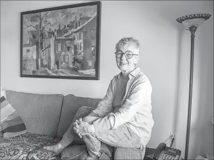  ?? Clem Murray/Philadelph­ia Inquirer/TNS ?? Madeleine McHugh Pierucci, 77, sits on the arm rest of her couch Oct. 25 in her Rittenhous­e Square co-op and reminicese­s about her years at the University of Pennsylvan­ia’s Wharton School in the late 1950s. McHugh Pierucci was the first in her family...