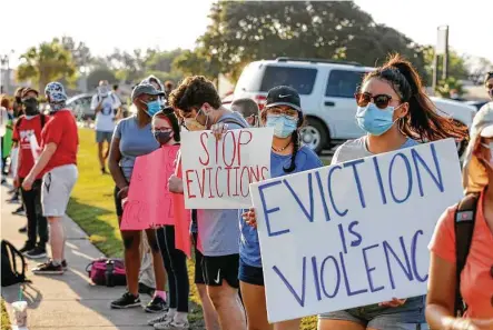  ?? Photos by Steve Gonzales / Staff photograph­er ?? Demonstrat­ors hold signs and chant during a protest Friday over evictions going on at the Precinct 5, Place 1 Harris County court, 6000 Chimney Rock in Houston. The group targeted Judge Russ Ridgway because of his eviction docket.