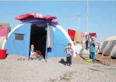  ?? — Reuters ?? Displaced people who fled Mosul are seen at Khazer camp, Iraq.