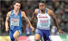  ??  ?? MATTHIAS HANGST/GETTY IMAGES Britain’s Zharnel Hughes (R) and Filippo Tortu of Italy are in action in the men's 100m final at the 2018 European Championsh­ips in Olympic Stadium in Berlin, Germany, on August 7, 2018.