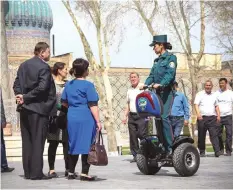  ??  ?? Fatima riding on a Segway while on duty.