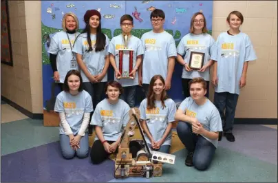  ?? The Sentinel-Record/Richard Rasmussen ?? WINNING TEAM: Members of the Lakeside Middle School robotics display their robot and trophy Thursday after having won first place in the state BEST competitio­n and 12th place against teams from eight states in the regional competitio­n. Team members are front, from left, Lilly Hardin, Meagan Abney, Emerson Foster and Lyla Hill, and back, from left, teacher Stacey Jones, Melissa Garcia, Clint Fox, Riley Cantrell, Sela Cox and Will Anderson.